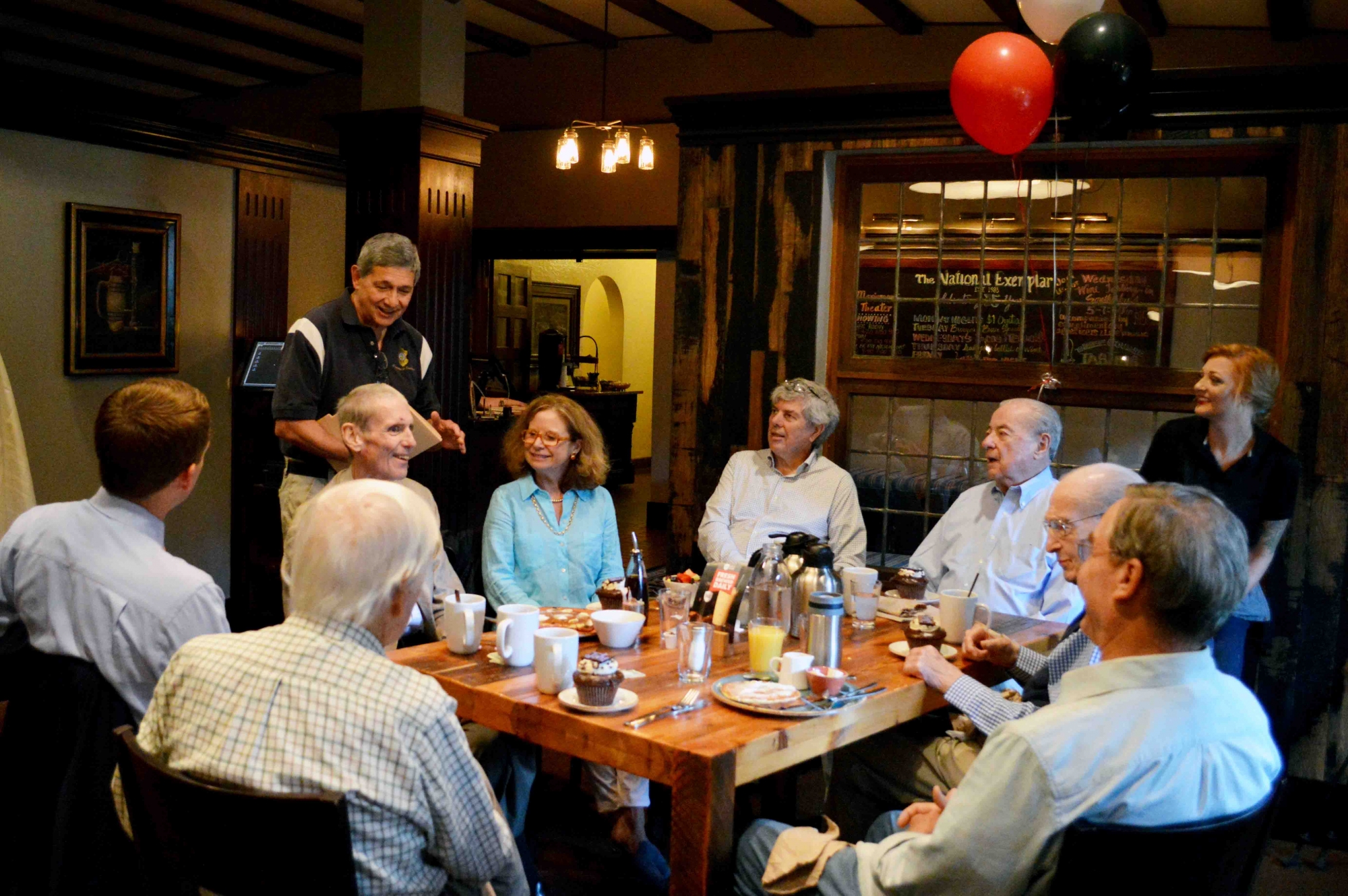 Mayor Policastro presents Men's Tuesday Breakfast Club with a proclamation.